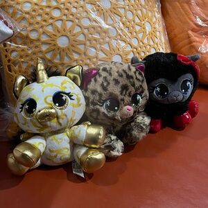 a collection of GUND P.Lushes Pets designer plush toys.
